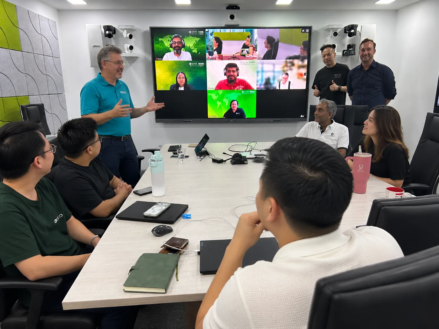 Byron leading a strategy workshop with participants in the room and joining remotely